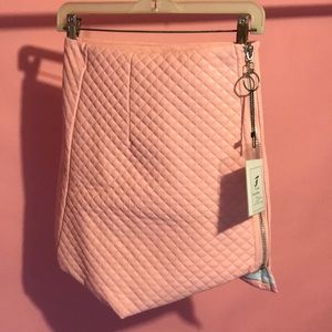 Pink pleated asymmetric skirt